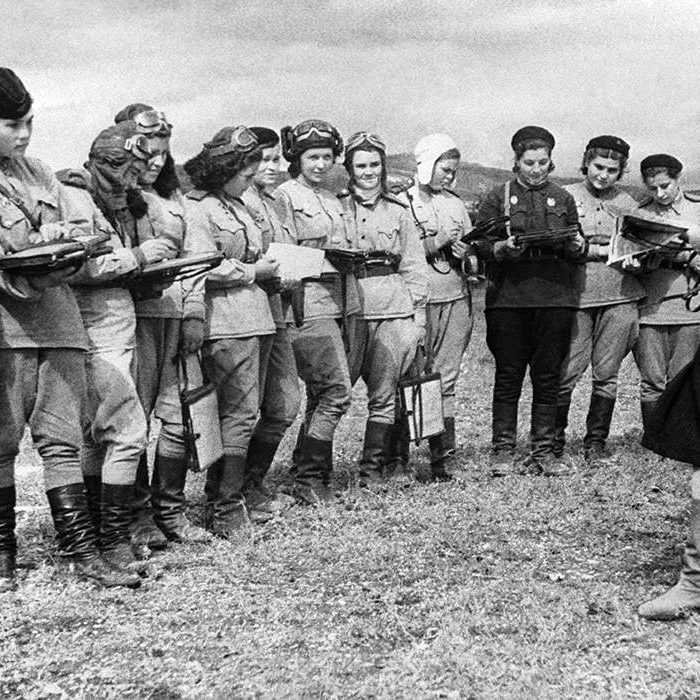 Top Photo: Deputy Commander Serafima Tarasovna Amosova assigns a combat mission to the pilots of the 46th Guards Night Bomber Aviation Regiment. September 15, 1943. Wikimedia Commons